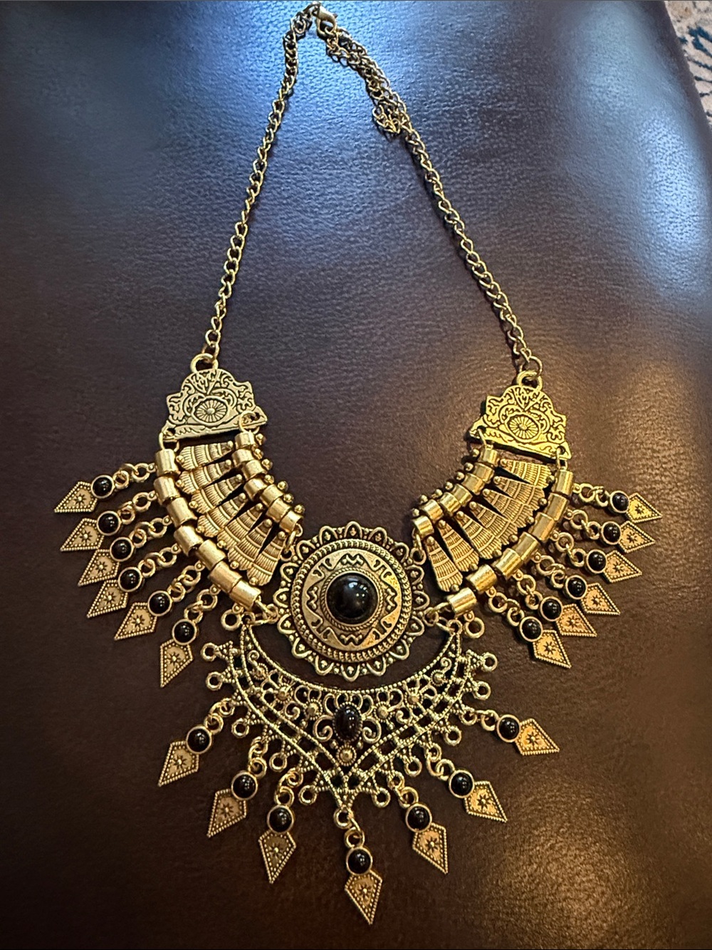 Gold-Tone Statement Necklace With Black Accents and Fringe